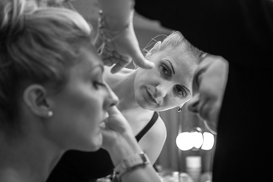 friend watching the bride's make up