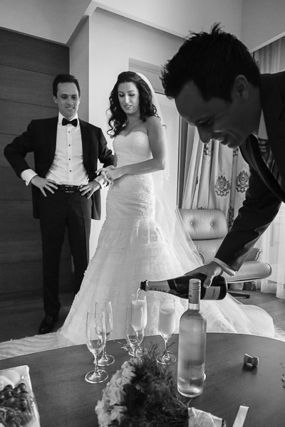 Groom's brother pouring champagne