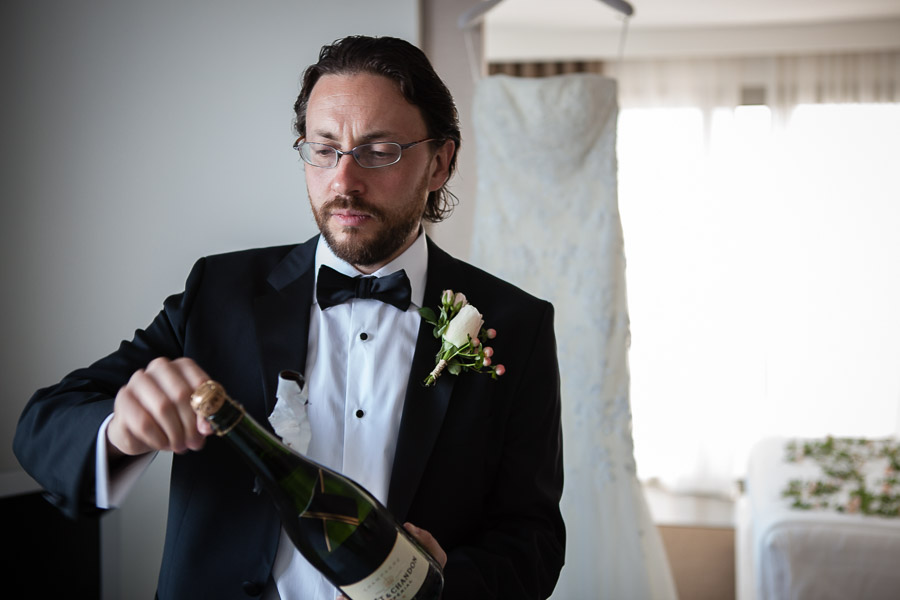 bodrum wedding groom opening champagne