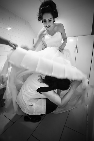 bride putting on her dress