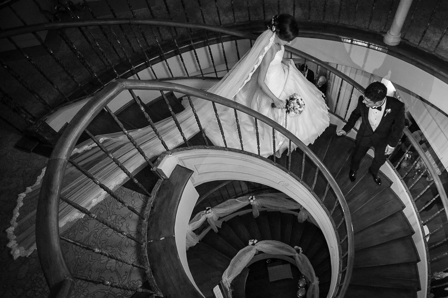 bride groom walking down stairs