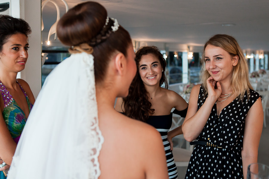 friends watch over bride before boat wedding