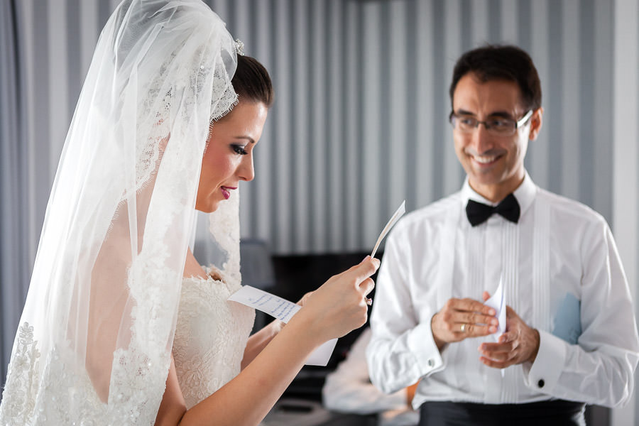 bride and groom reading their letters to each other