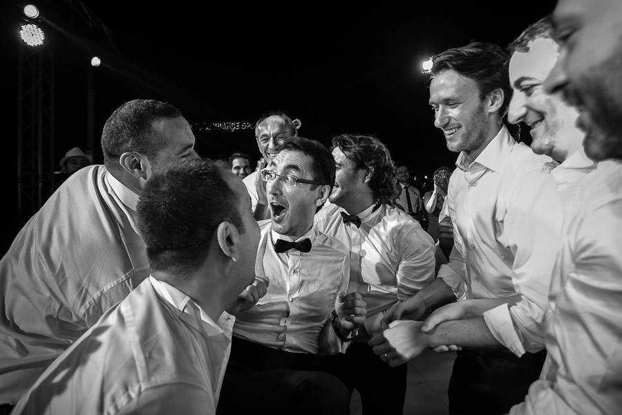 throwing the groom into the pool