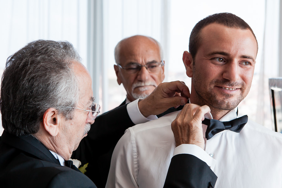 Groom getting ready for wedding at DoubleTree Hilton Moda