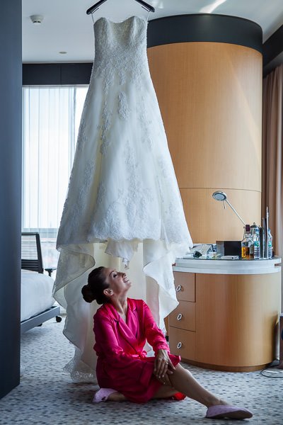 Bride sitting under the wedding dress