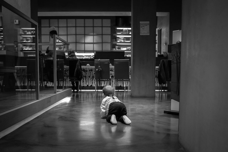 toddler exploring the restaurant in grand hyatt 