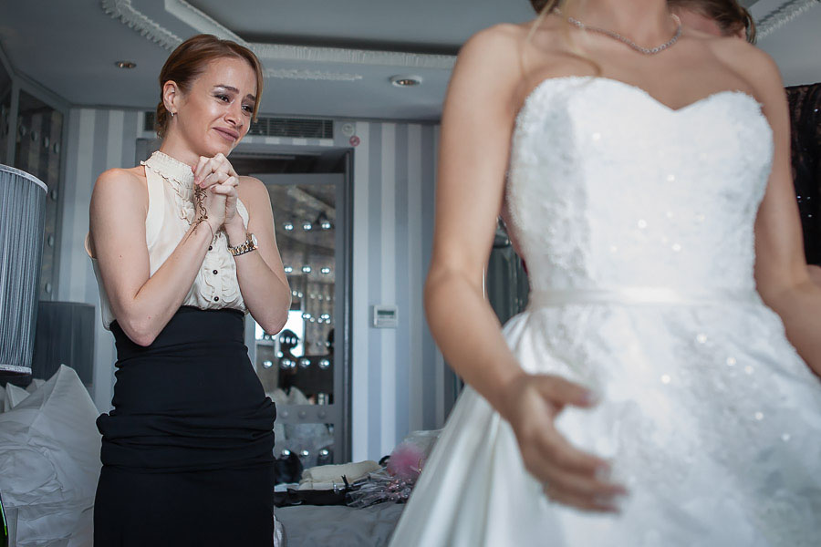 Bridesmaid getting emotional looking at the bride