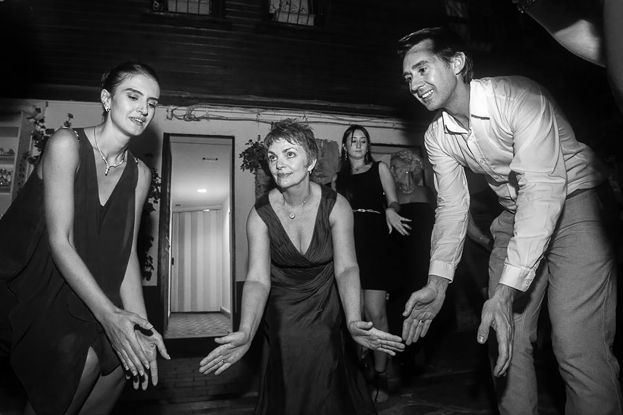 Groom dancing with guests