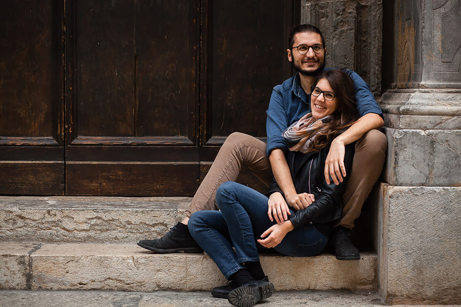 couple sitting on stairs in sicily