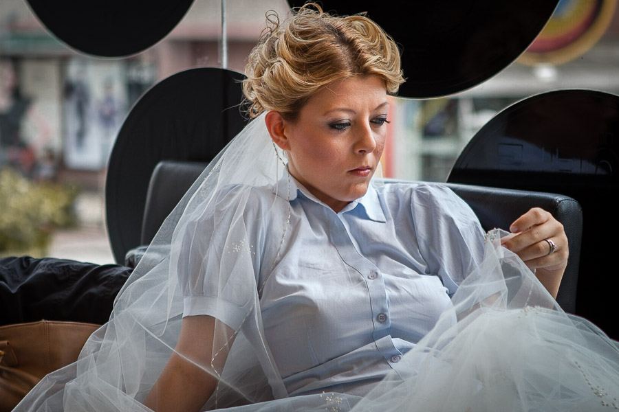 Bride waits for her turn at hair salon