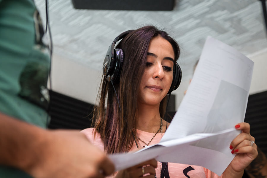 girl checking the lyrics in recording studio