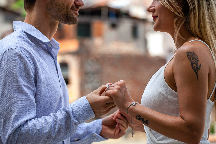 engaged couple holding hands in photoshoot