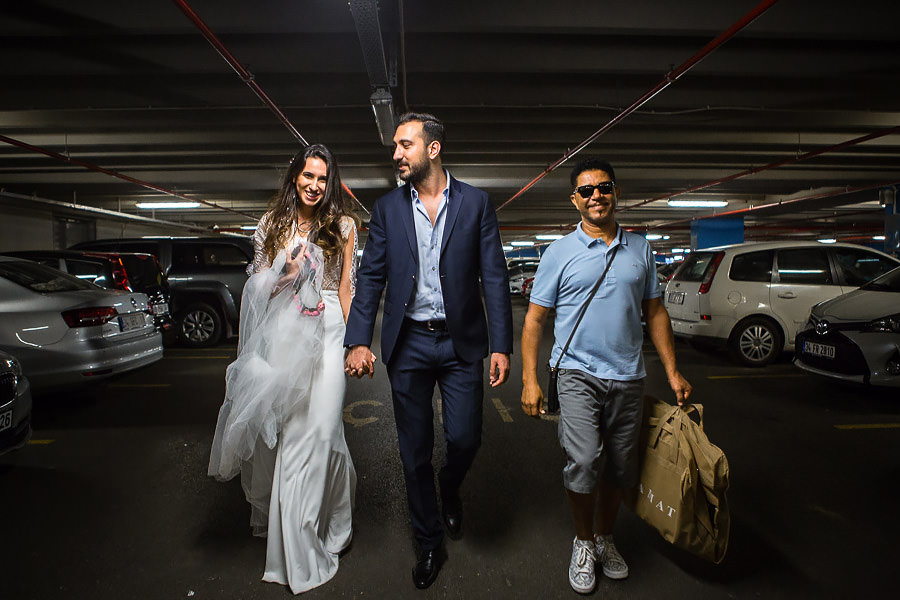 bride groom and singer in parking lot