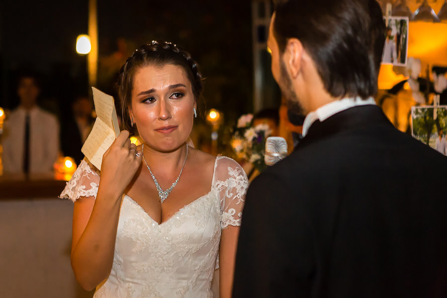 bride listens to grooms speech in tears
