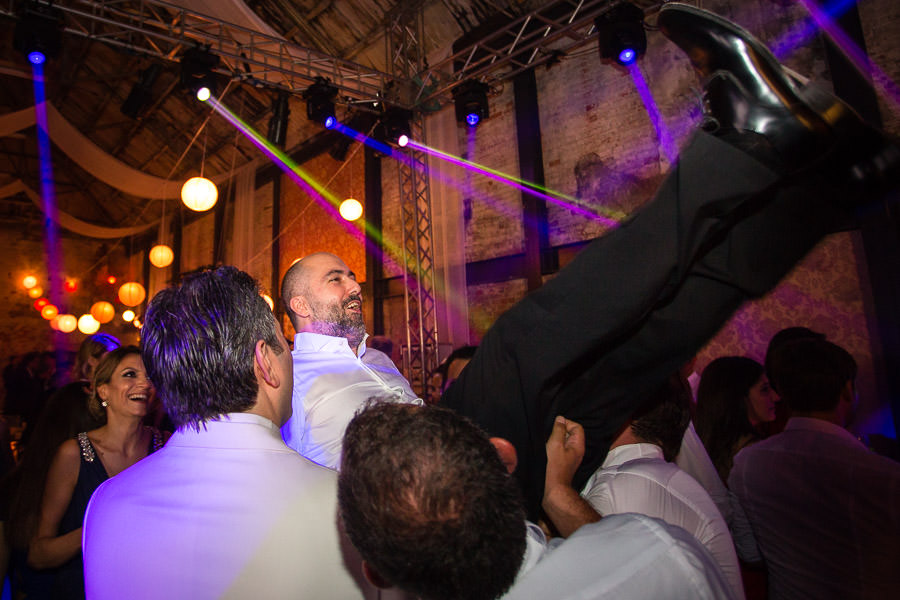 throwing the groom in the air at beykoz shoe factory wedding