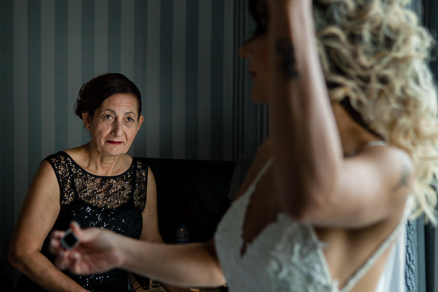 mother looking at the bride