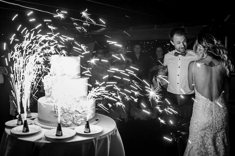 sparklers on wedding cake on a windy night