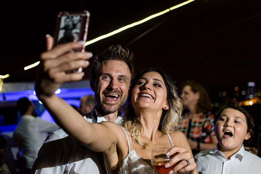 bride and groom taking selfie at reception