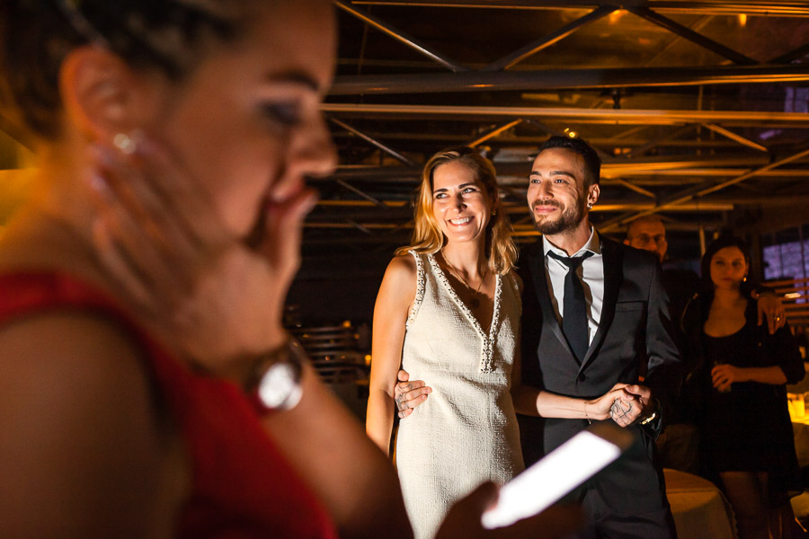 bride and groom during speeches at wedding