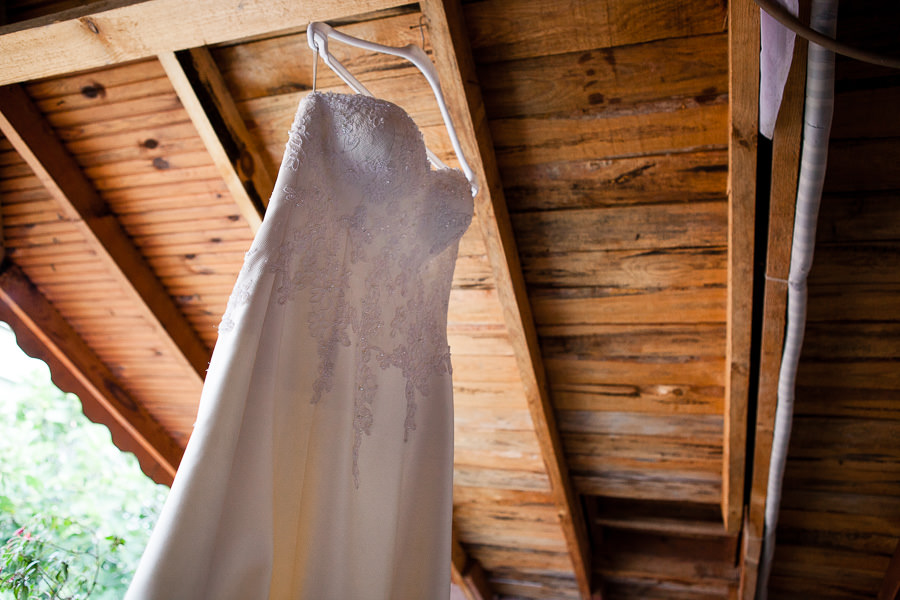 wedding dress hanging from the ceiling