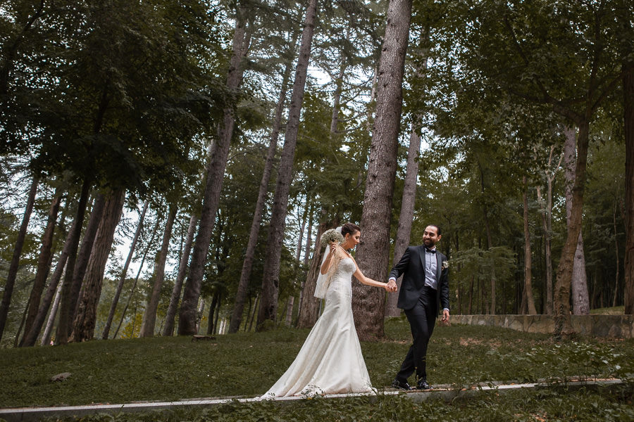 bride and groom in woods