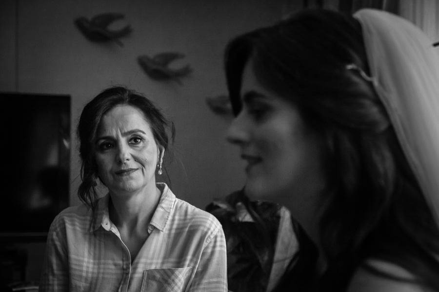 mother of the bride watches her daughter 