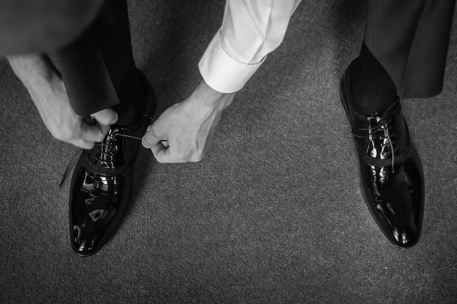 groom tying his shoes