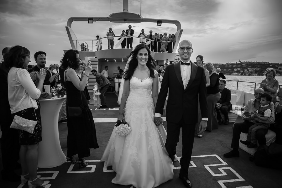 bride and groom walking through guests on the bosphorus